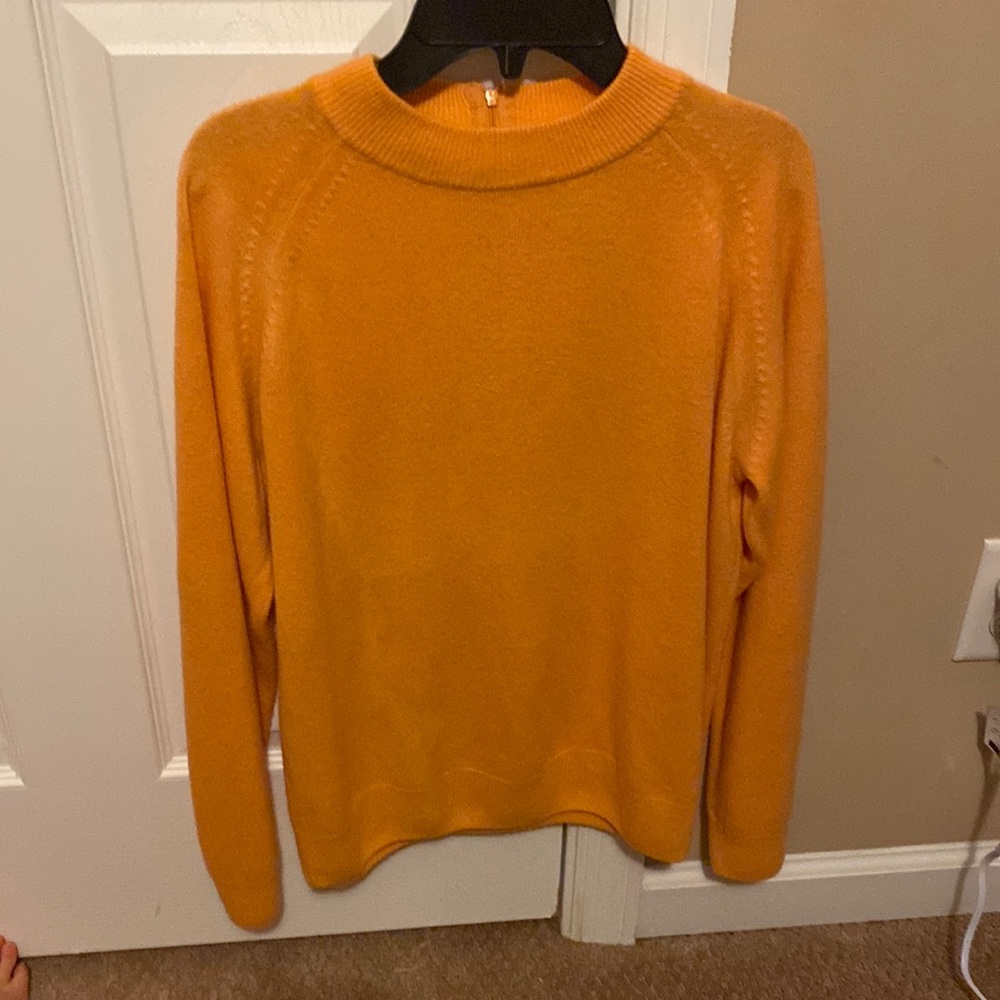 Orange turtleneck with long sleeves